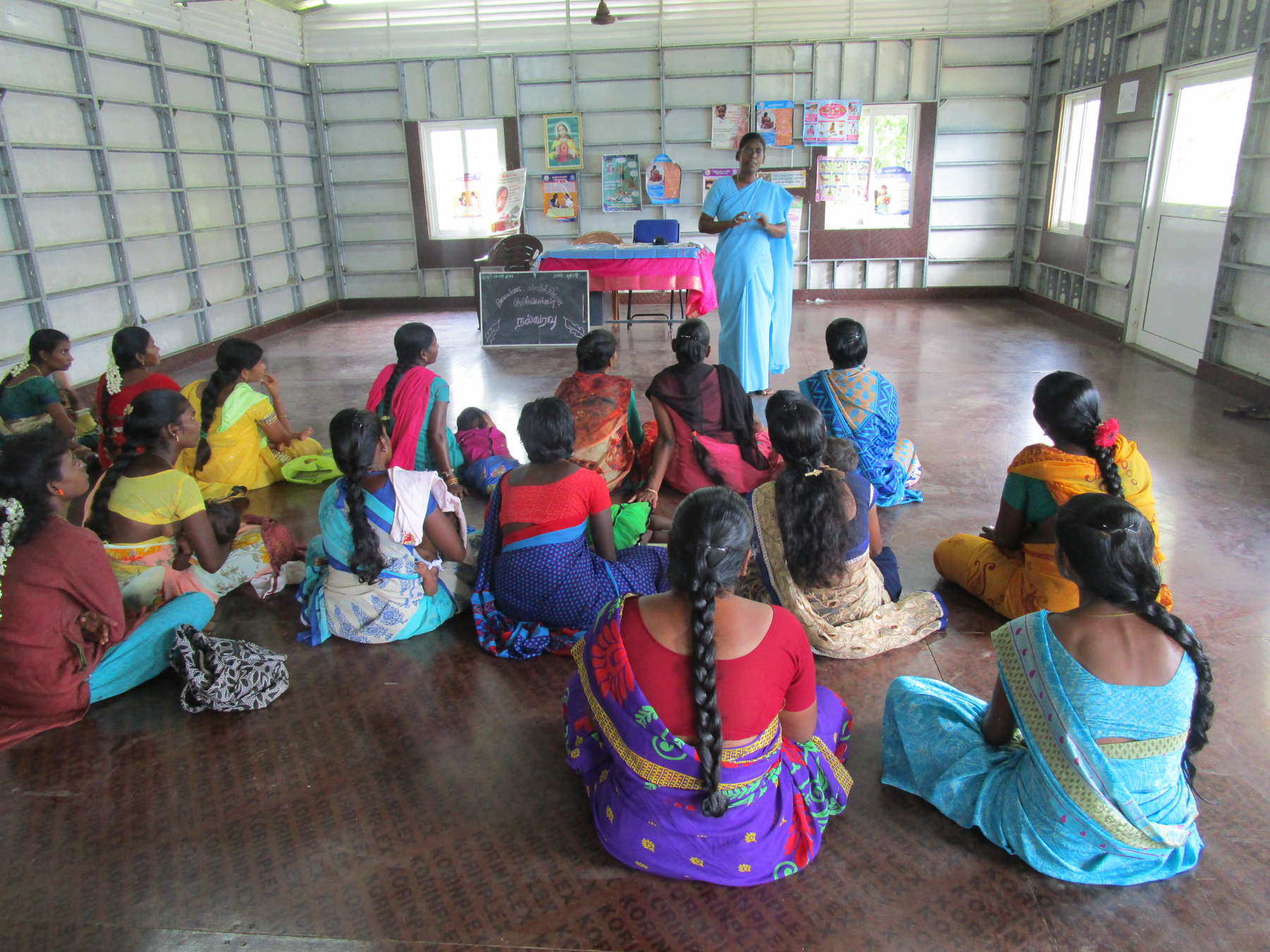 Sr Arul Kala Royappan giving awareness on health to Self Help Group women.